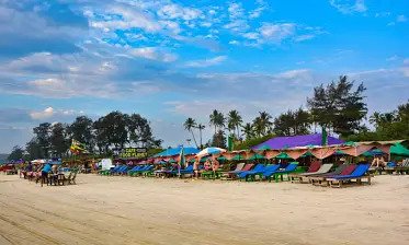 Mandrem Beach Unwind at a serene beach with a reliable cab for sightseeing in Goa Call today
